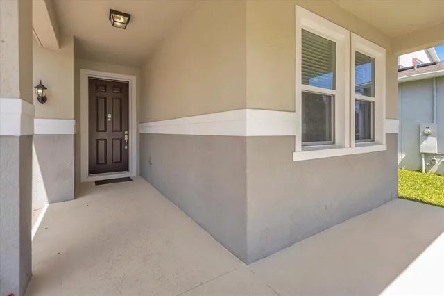 a view of an empty room with windows