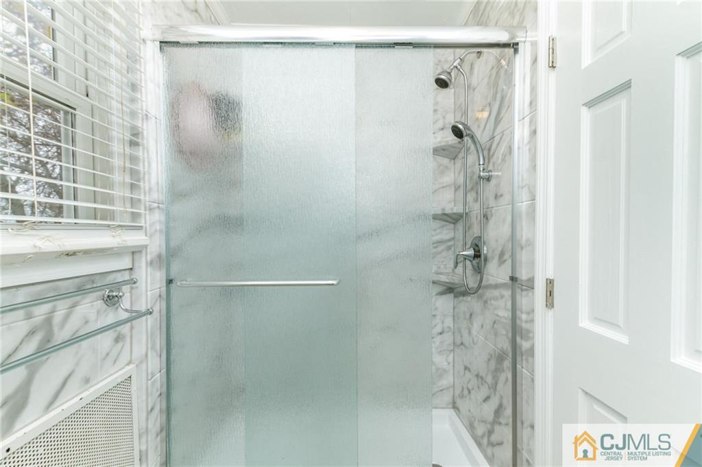 302 Norwood Avenue Old Bridge, NJ 08879 - Photo 15 of 19 a bathroom with a shower