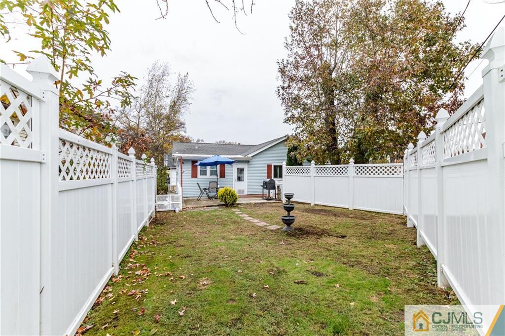 302 Norwood Avenue Old Bridge, NJ 08879 - Photo 18 of 19 a view of a back yard of the house
