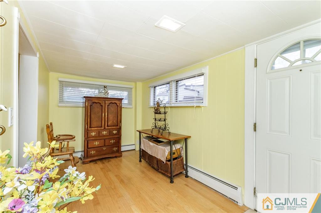 302 Norwood Avenue Old Bridge, NJ 08879 - Photo 3 of 19 a bedroom with furniture and a window