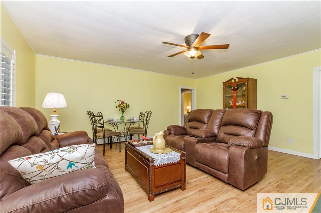 302 Norwood Avenue Old Bridge, NJ 08879 - Photo 5 of 19 a living room with furniture and a ceiling fan
