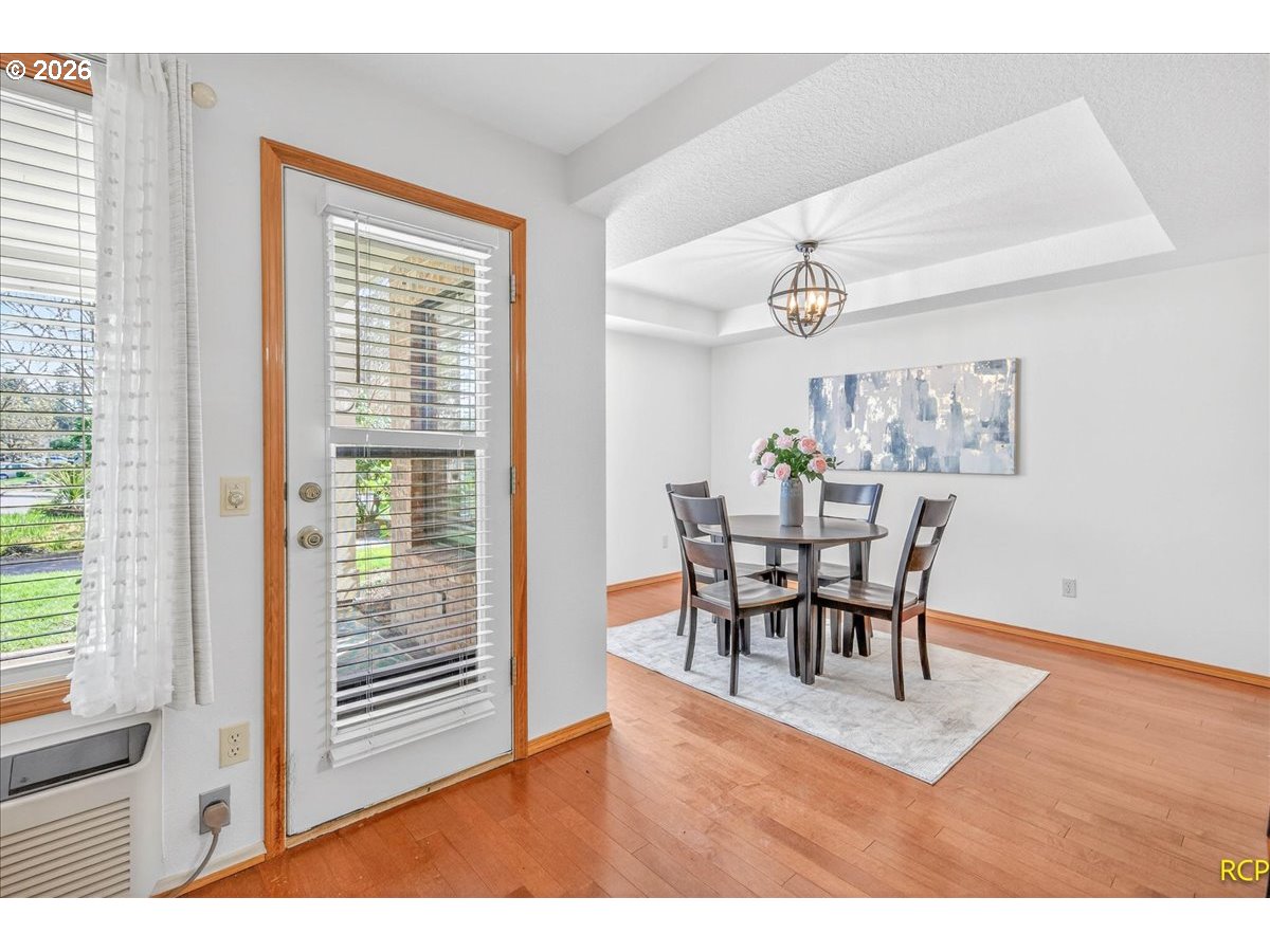 16444 Southwest 130th Terrace, Unit 121 Portland, OR 97224 - Photo 14 of 40 a dining room with furniture and window