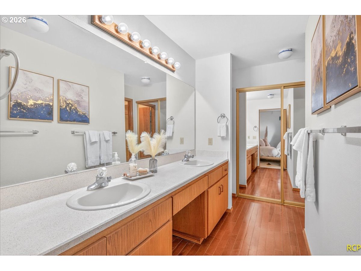 16444 Southwest 130th Terrace, Unit 121 Portland, OR 97224 - Photo 29 of 40 a en suite bathroom with a sink and a mirror