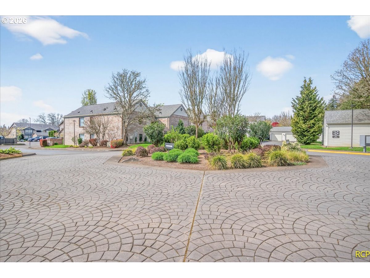 16444 Southwest 130th Terrace, Unit 121 Portland, OR 97224 - Photo 35 of 40 a street view with couple of cars parked in front of it