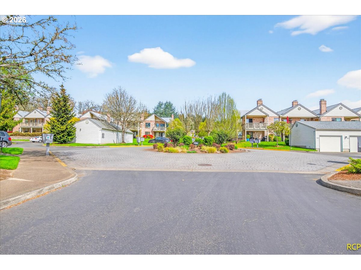 16444 Southwest 130th Terrace, Unit 121 Portland, OR 97224 - Photo 36 of 40 a view of a street with a houses