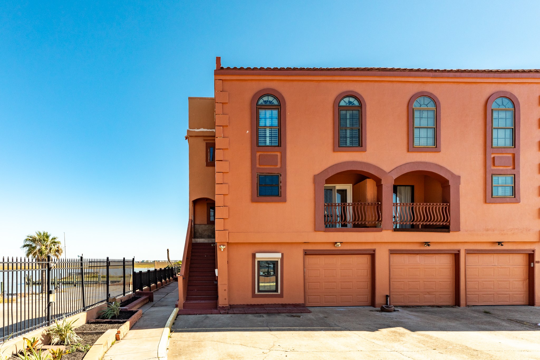 411 Sailfish Lane, Unit 101 Freeport, TX 77541 - Photo 13 of 46 a front view of a building with many windows