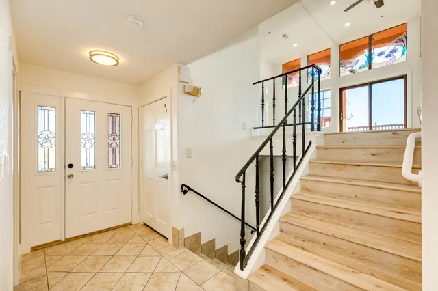 a view of an empty room and a window