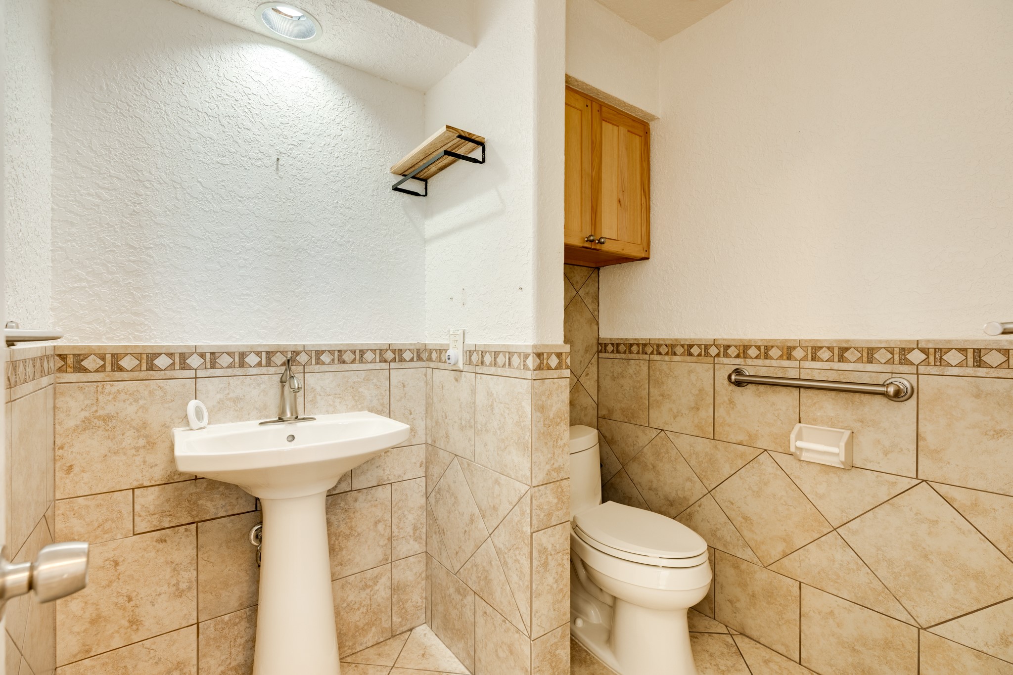 411 Sailfish Lane, Unit 101 Freeport, TX 77541 - Photo 26 of 46 a bathroom with a sink toilet and mirror
