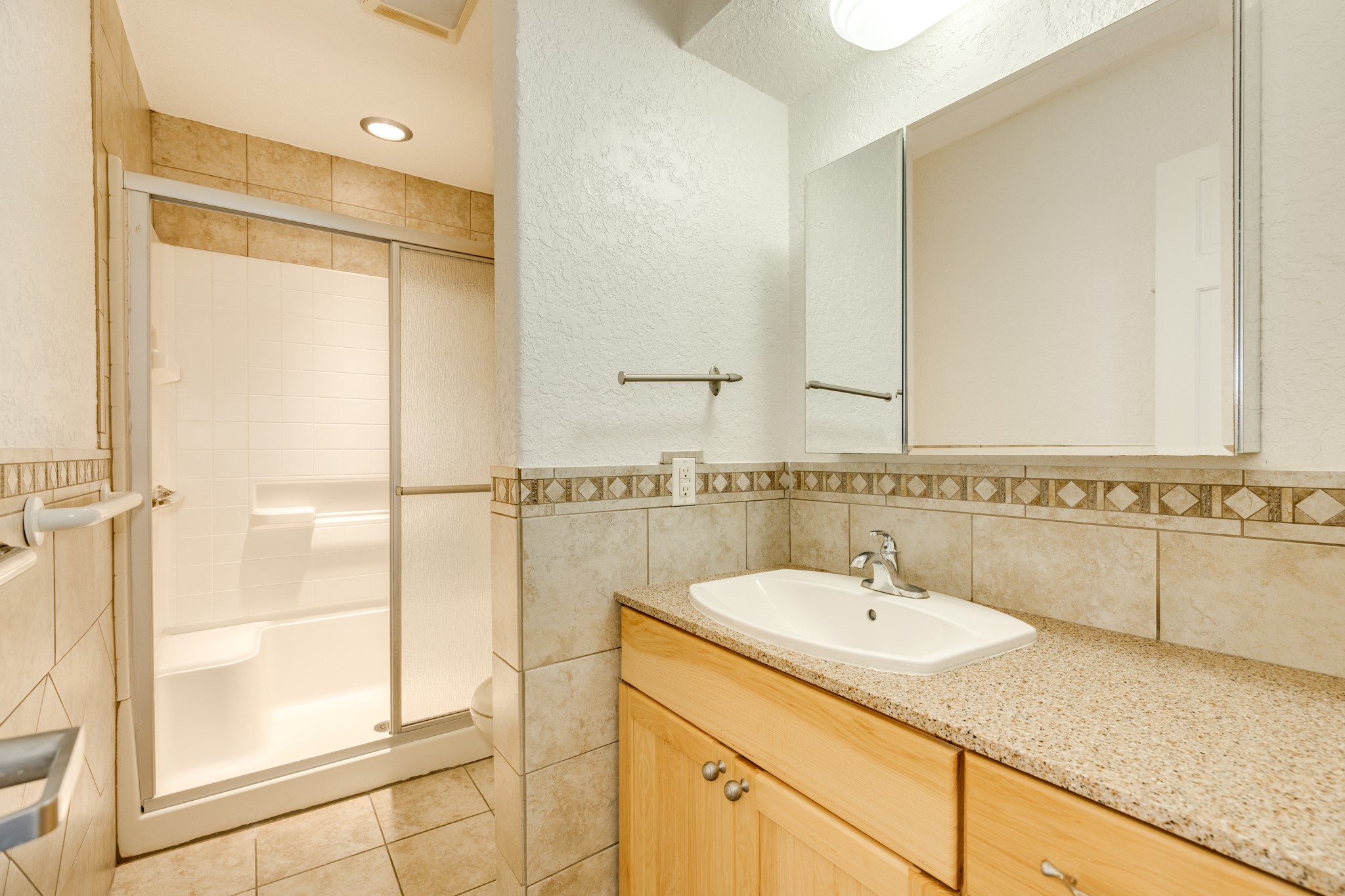 411 Sailfish Lane, Unit 101 Freeport, TX 77541 - Photo 33 of 46 a bathroom with a sink and a mirror