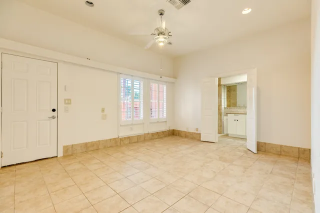 a view of an empty room with a bathroom