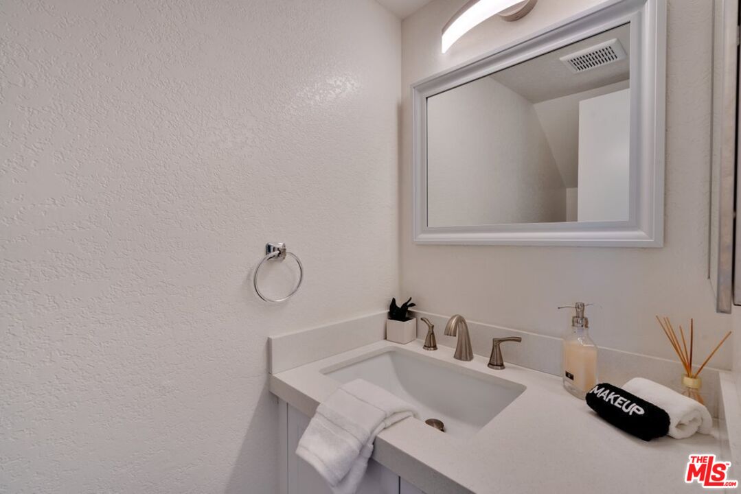48255 Monroe Street, Unit 56 Indio, CA 92201 - Photo 12 of 30 a bathroom with a sink and a mirror