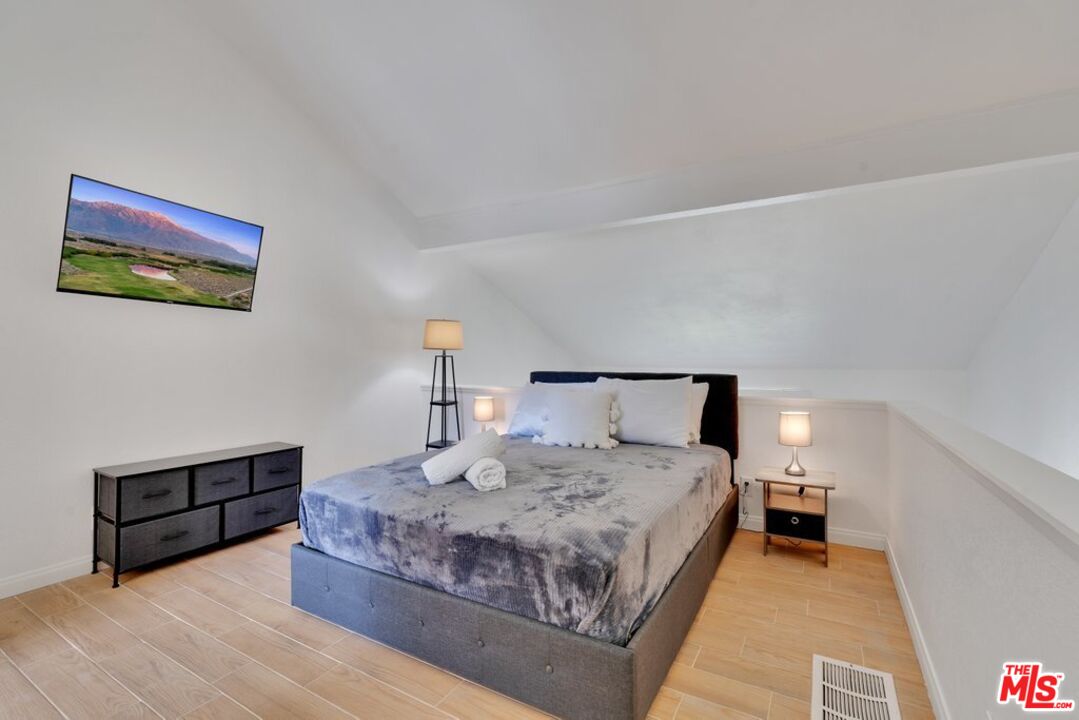 48255 Monroe Street, Unit 56 Indio, CA 92201 - Photo 13 of 30 a bedroom with a bed and window