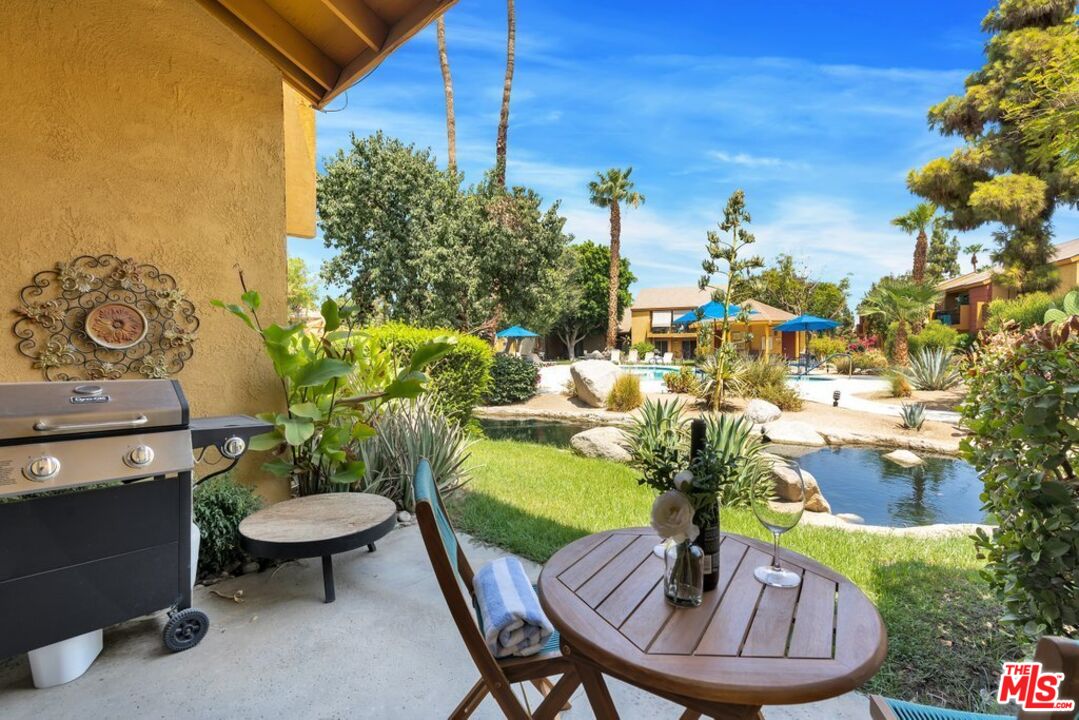 48255 Monroe Street, Unit 56 Indio, CA 92201 - Photo 19 of 30 a view of a chairs and table in patio