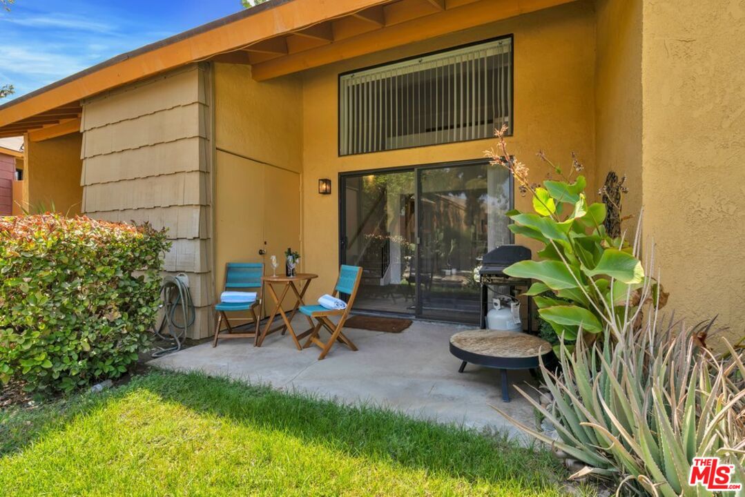 48255 Monroe Street, Unit 56 Indio, CA 92201 - Photo 20 of 30 a view of backyard with outdoor seating and plants