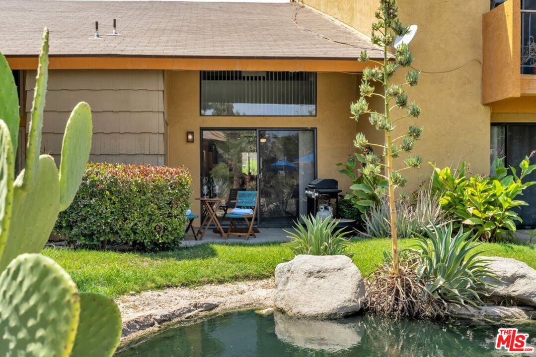 48255 Monroe Street, Unit 56 Indio, CA 92201 - Photo 21 of 30 a front view of a house with garden