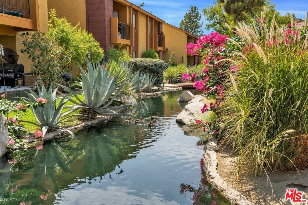 48255 Monroe Street, Unit 56 Indio, CA 92201 - Photo 22 of 30 a flower in a garden view