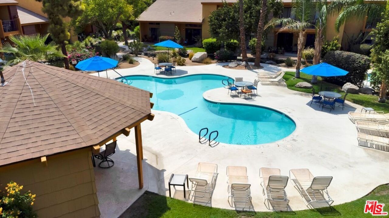 48255 Monroe Street, Unit 56 Indio, CA 92201 - Photo 27 of 30 swimming pool view with a seating space