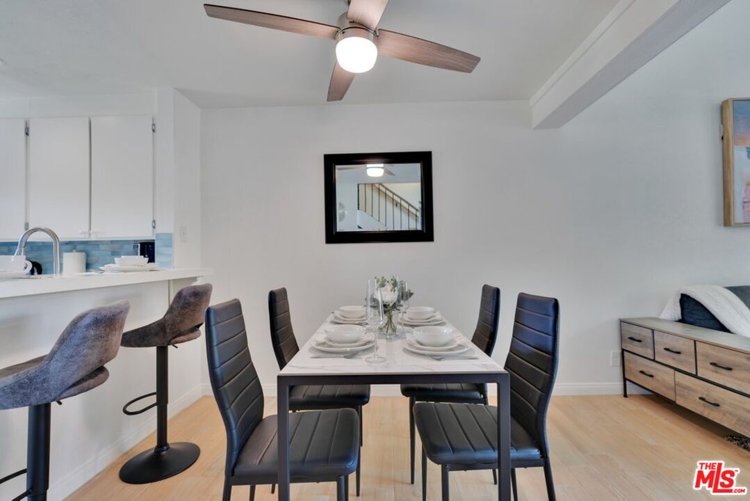 48255 Monroe Street, Unit 56 Indio, CA 92201 - Photo 3 of 30 a view of a dining room with furniture and wooden floor