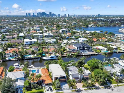 an aerial view of multiple houses with outdoor space