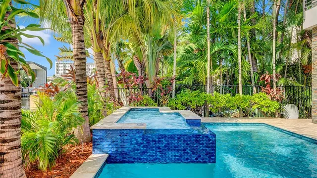 a living room with furniture a rug and a chandelier