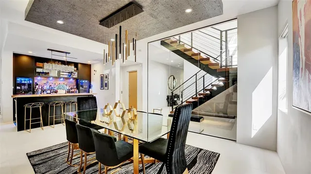 a bedroom with furniture and a large window