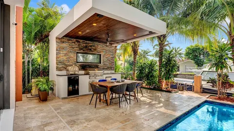 a view of a livingroom with furniture and a mirror