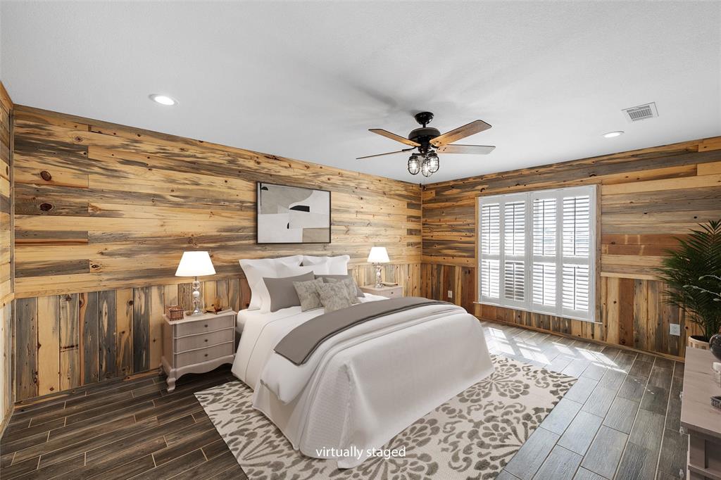 5112 Old Caufield Ranch Road McGregor, TX 76657 - Photo 21 of 38 Bedroom featuring wood finish floors, a ceiling fan, recessed lighting, and wooden walls
