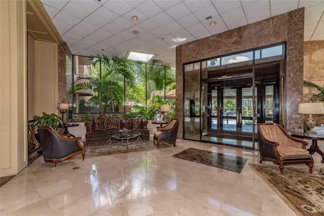 a building outdoor space with patio furniture and potted plants