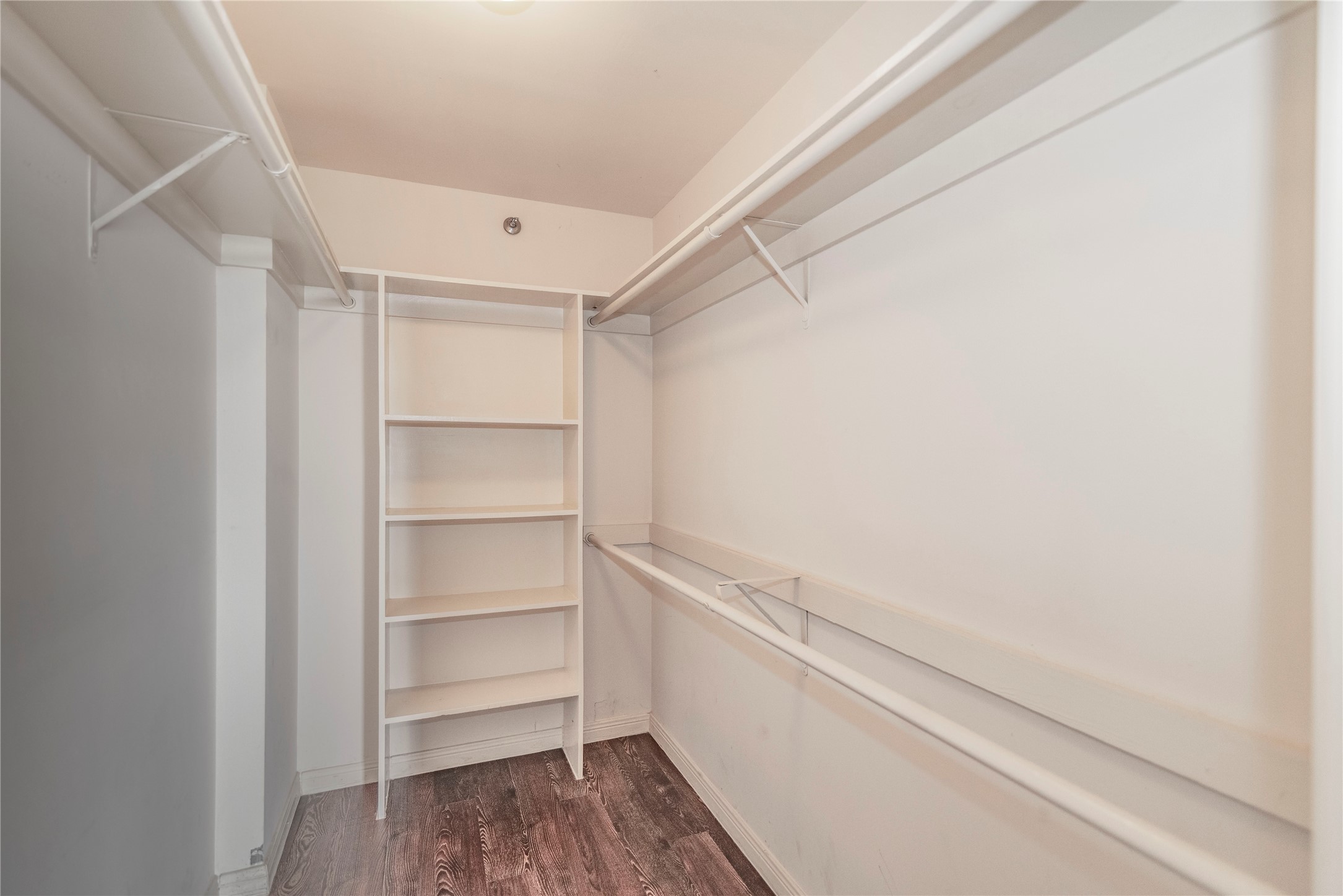 3525 Sage Road, Unit 1402 Houston, TX 77056 - Photo 12 of 19 a view of walk in closet with empty racks