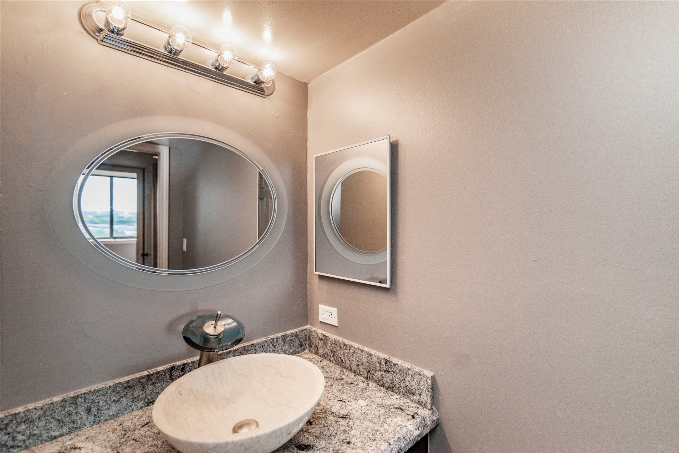 3525 Sage Road, Unit 1402 Houston, TX 77056 - Photo 14 of 19 a bathroom with a toilet mirror vanity and vanity