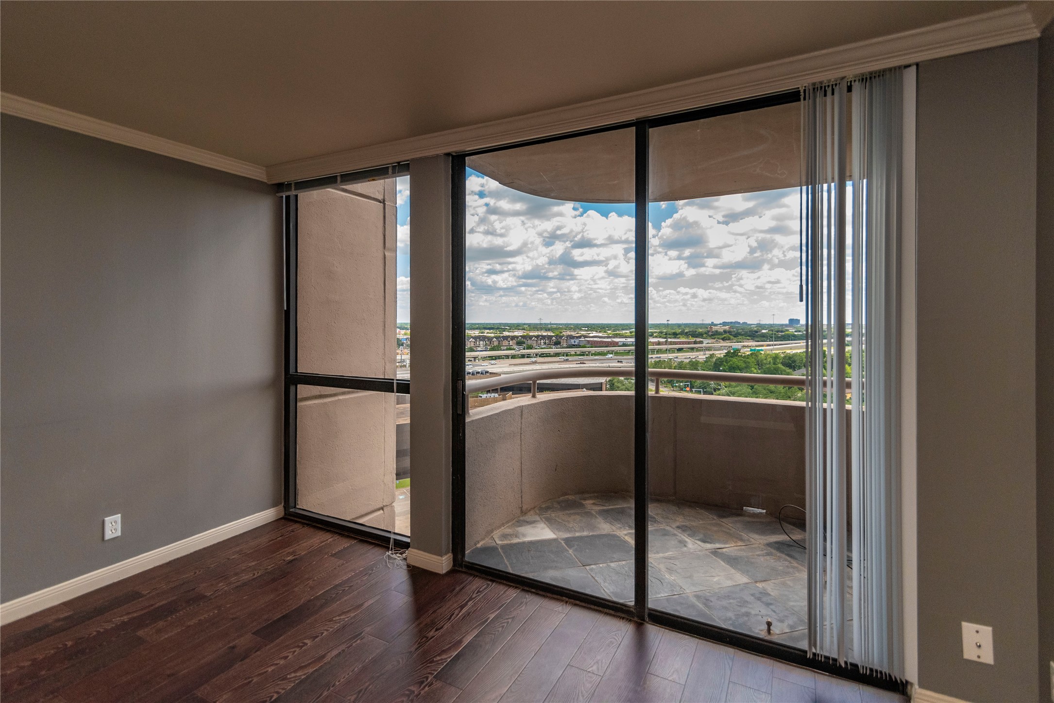 3525 Sage Road, Unit 1402 Houston, TX 77056 - Photo 17 of 19 a view of a room with wooden floor and doors