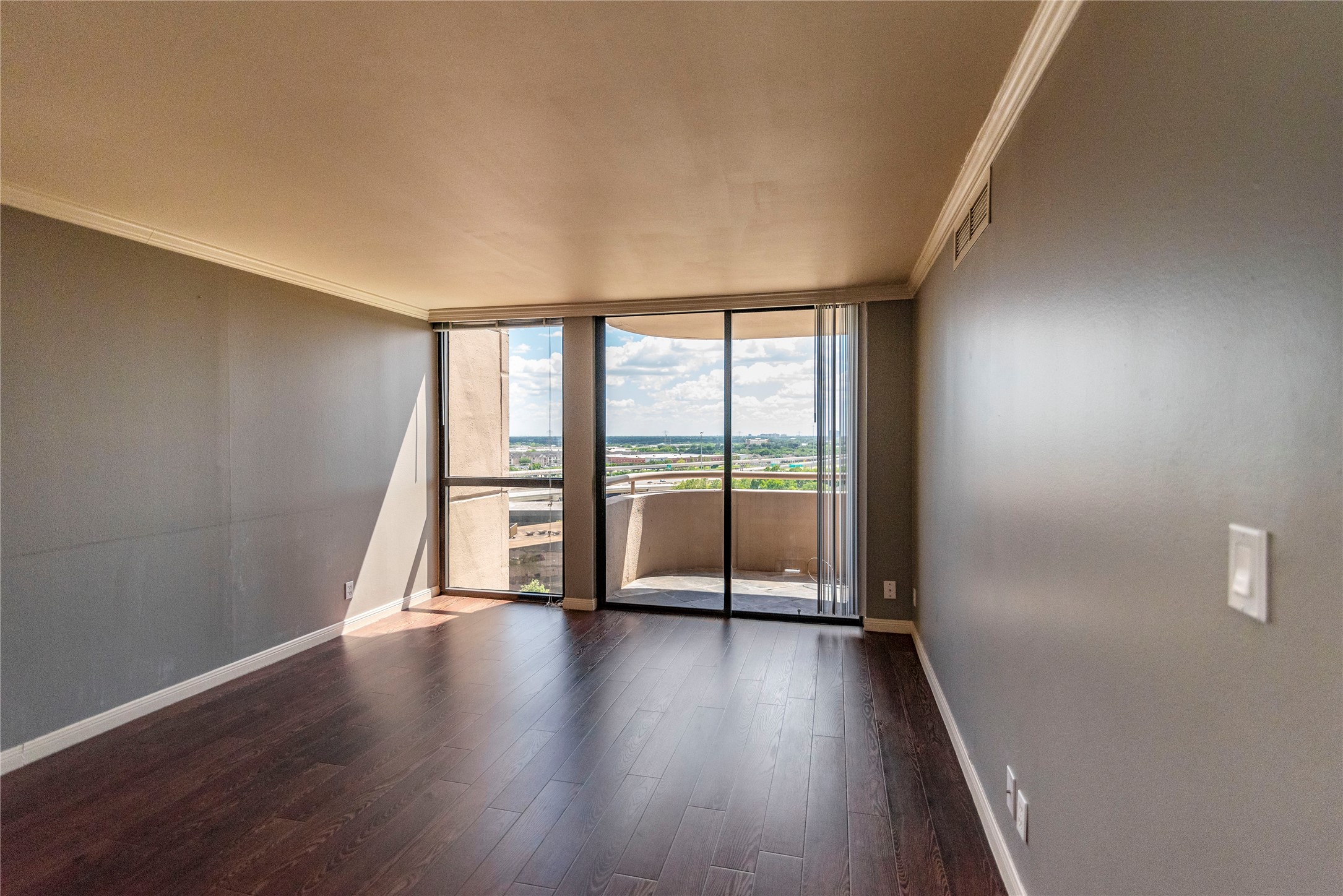 3525 Sage Road, Unit 1402 Houston, TX 77056 - Photo 8 of 19 a view of an empty room with wooden floor and a window