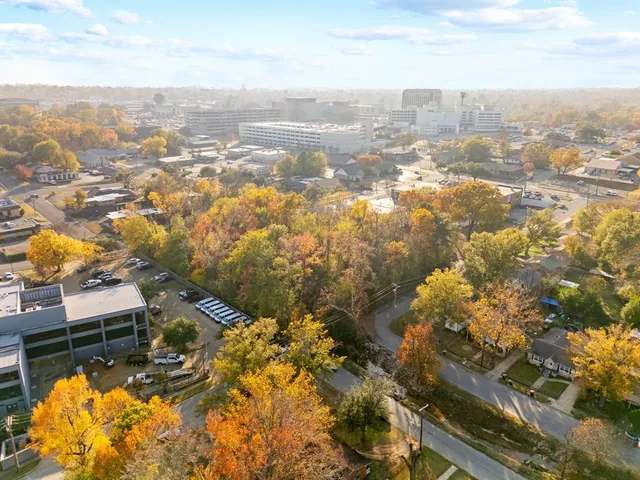 an aerial view of residential houses with outdoor space