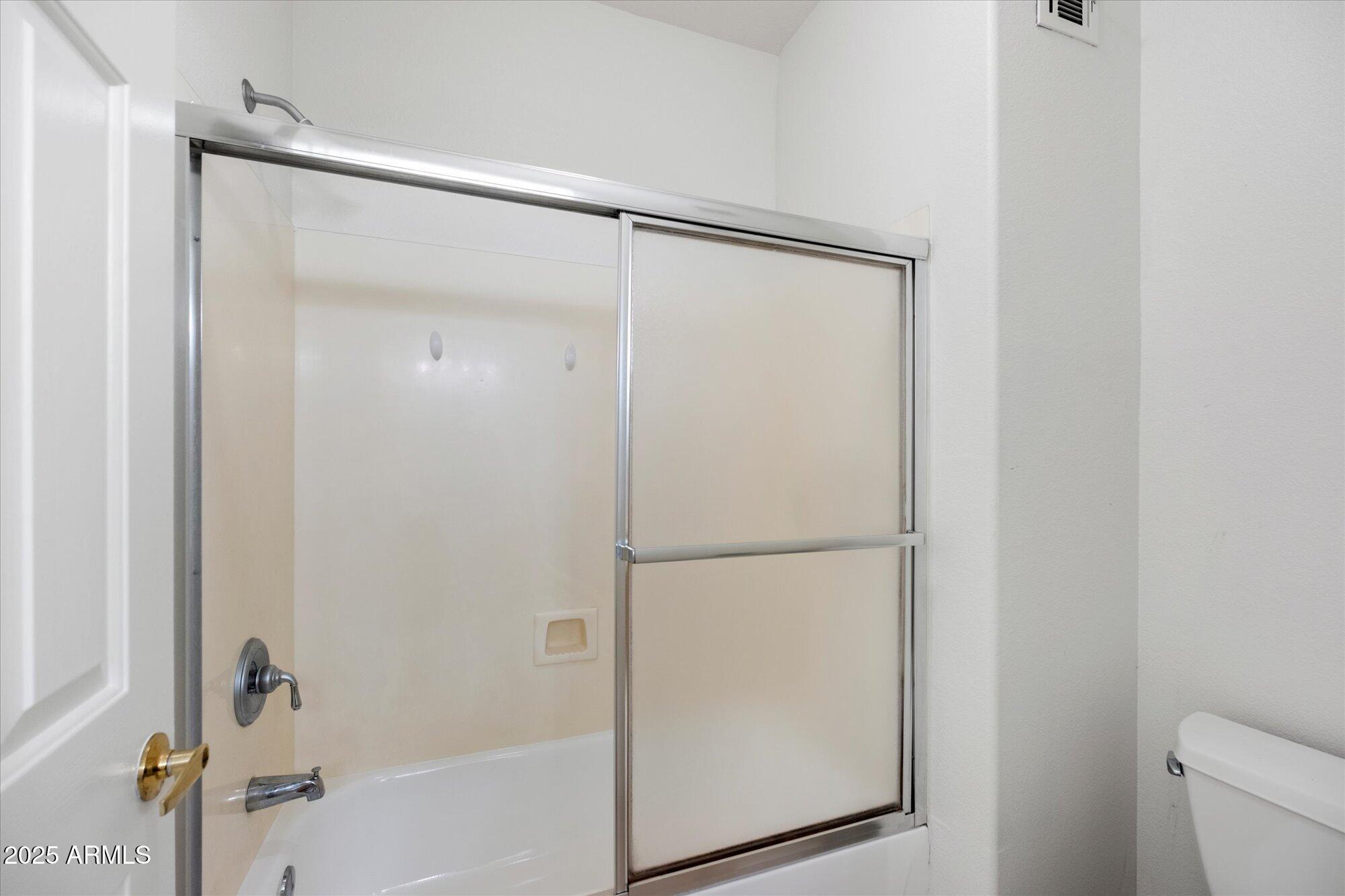1445 East Broadway Road, Unit 120 Tempe, AZ 85282 - Photo 14 of 39 a bathroom with a glass shower door