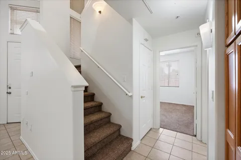a bathroom with a toilet a sink and a mirror