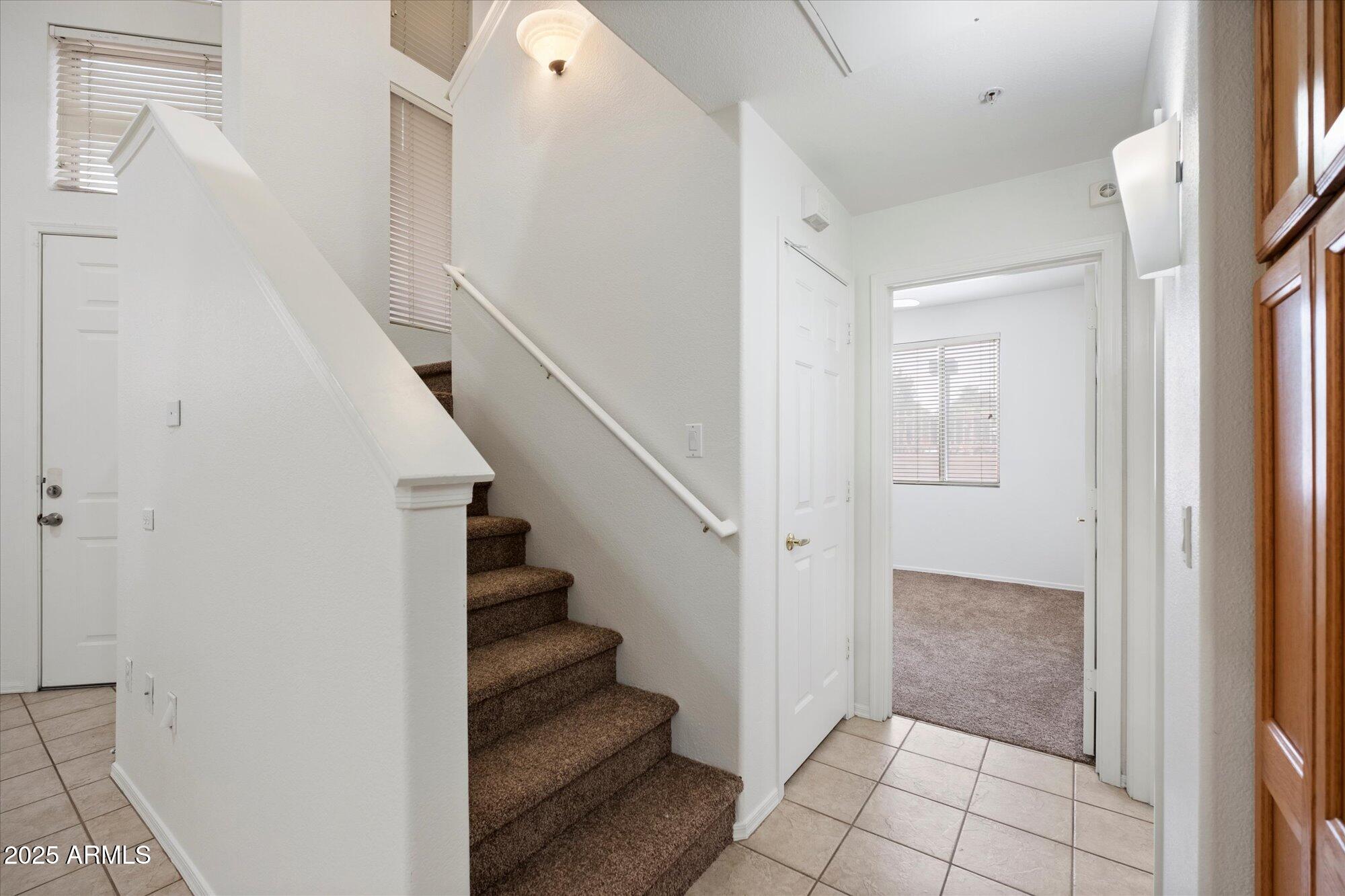 1445 East Broadway Road, Unit 120 Tempe, AZ 85282 - Photo 15 of 39 a view of entryway with stairs and white door