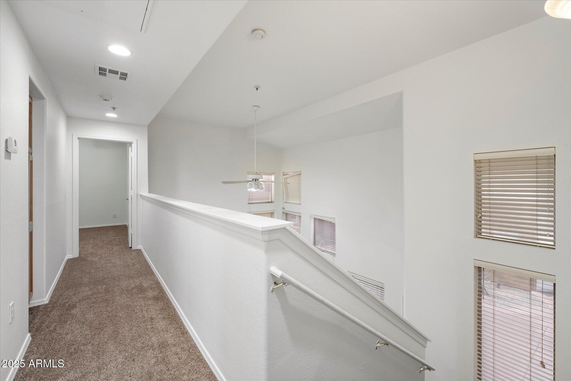 1445 East Broadway Road, Unit 120 Tempe, AZ 85282 - Photo 16 of 39 a view of a hallway with white cabinets