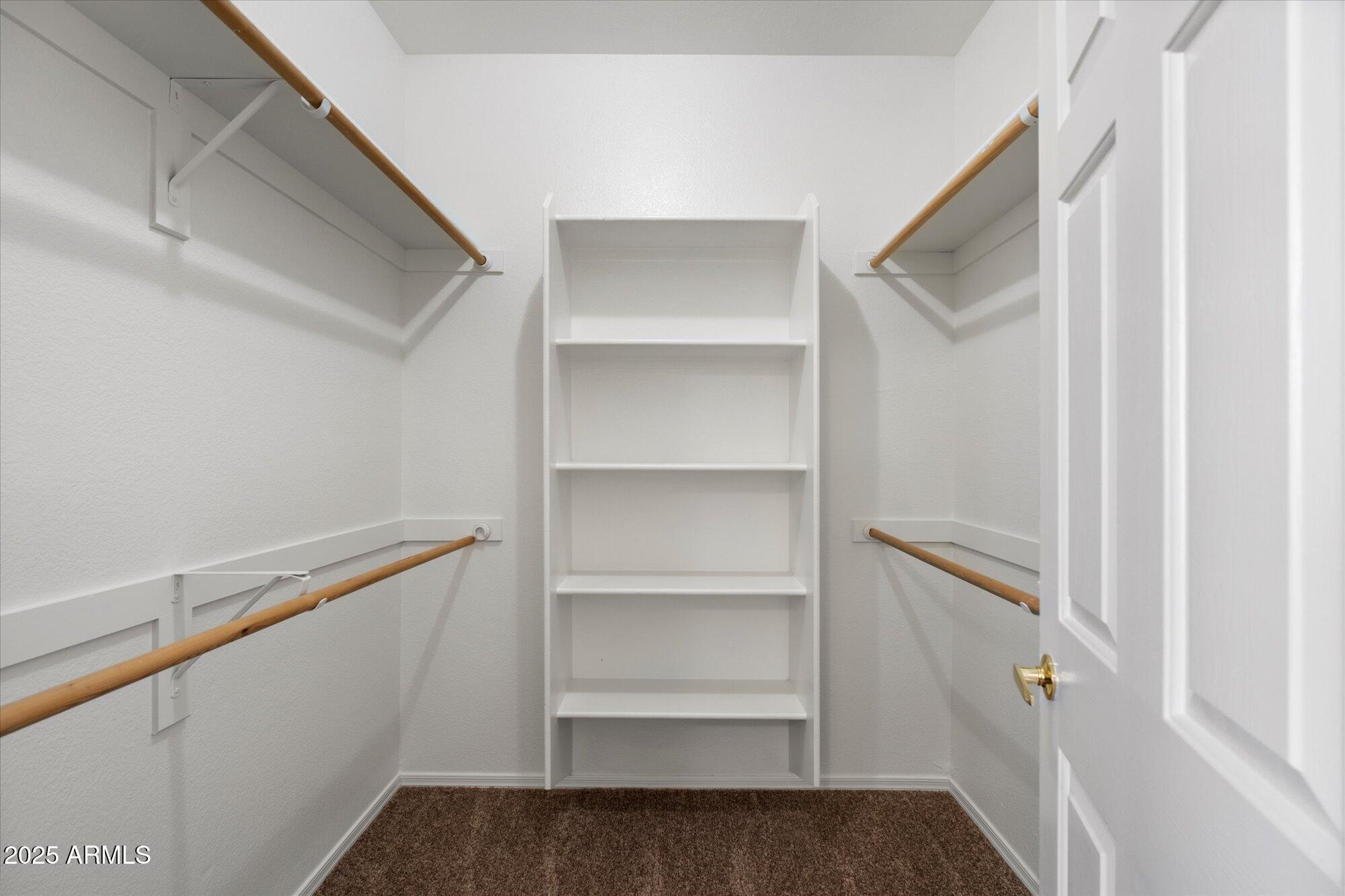 1445 East Broadway Road, Unit 120 Tempe, AZ 85282 - Photo 22 of 39 a view of walk in closet with empty racks
