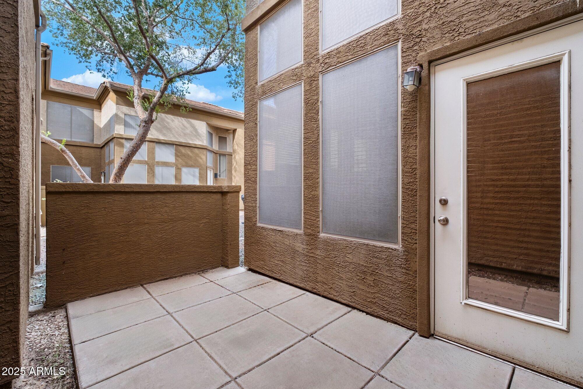 1445 East Broadway Road, Unit 120 Tempe, AZ 85282 - Photo 24 of 39 a view of a brick house with a door
