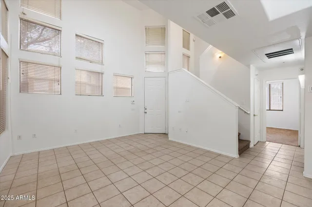 a view of a big room with closet and windows