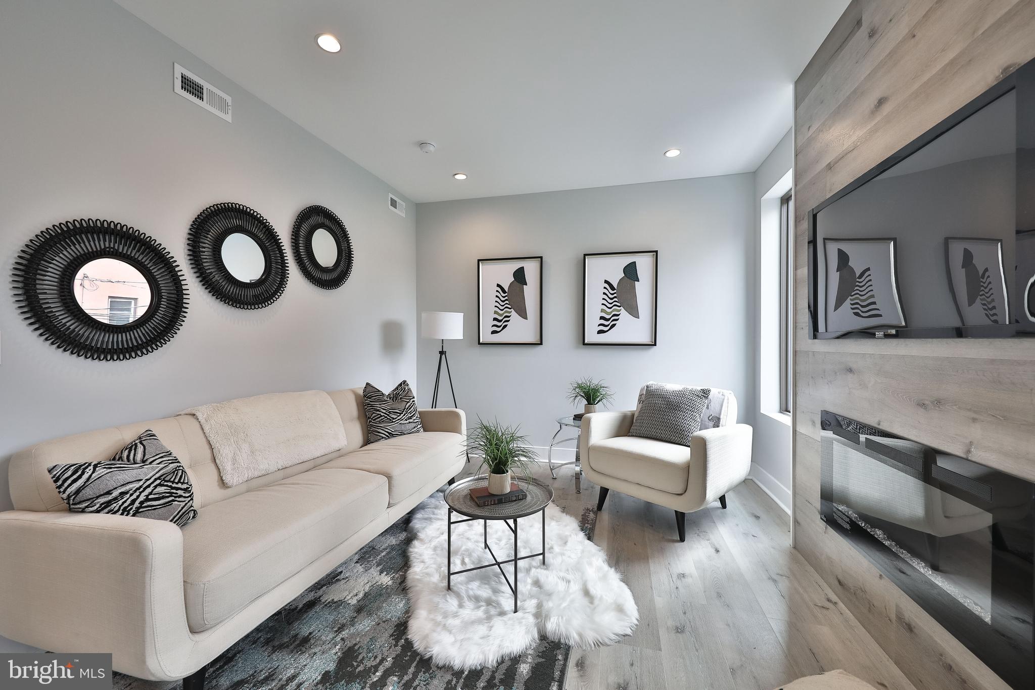 1540-42 Ridge Avenue, Unit 2S Philadelphia, PA 19130 - Photo 13 of 20 a living room with furniture and a couch