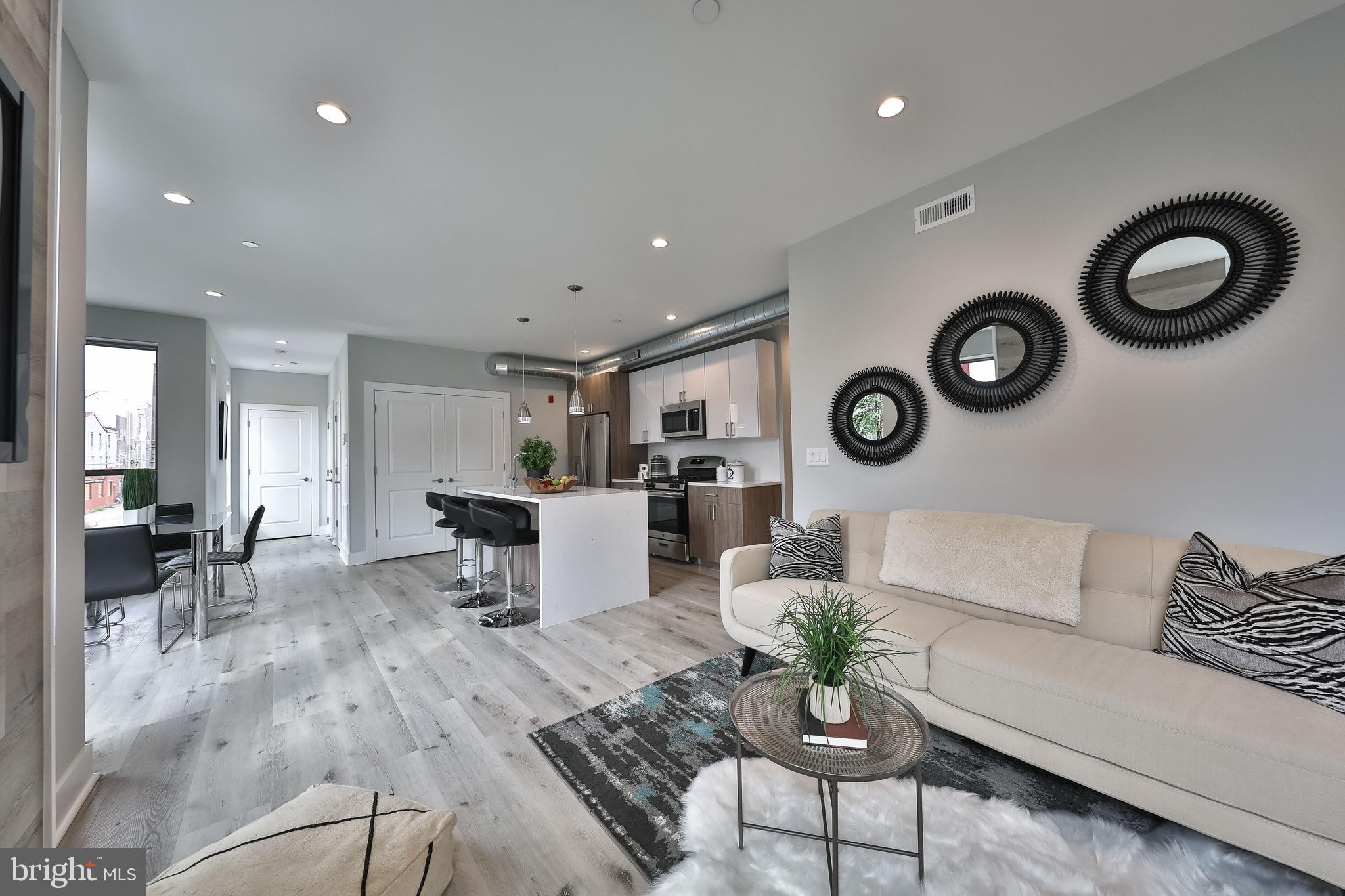 1540-42 Ridge Avenue, Unit 2S Philadelphia, PA 19130 - Photo 14 of 20 a living room with furniture and view of kitchen