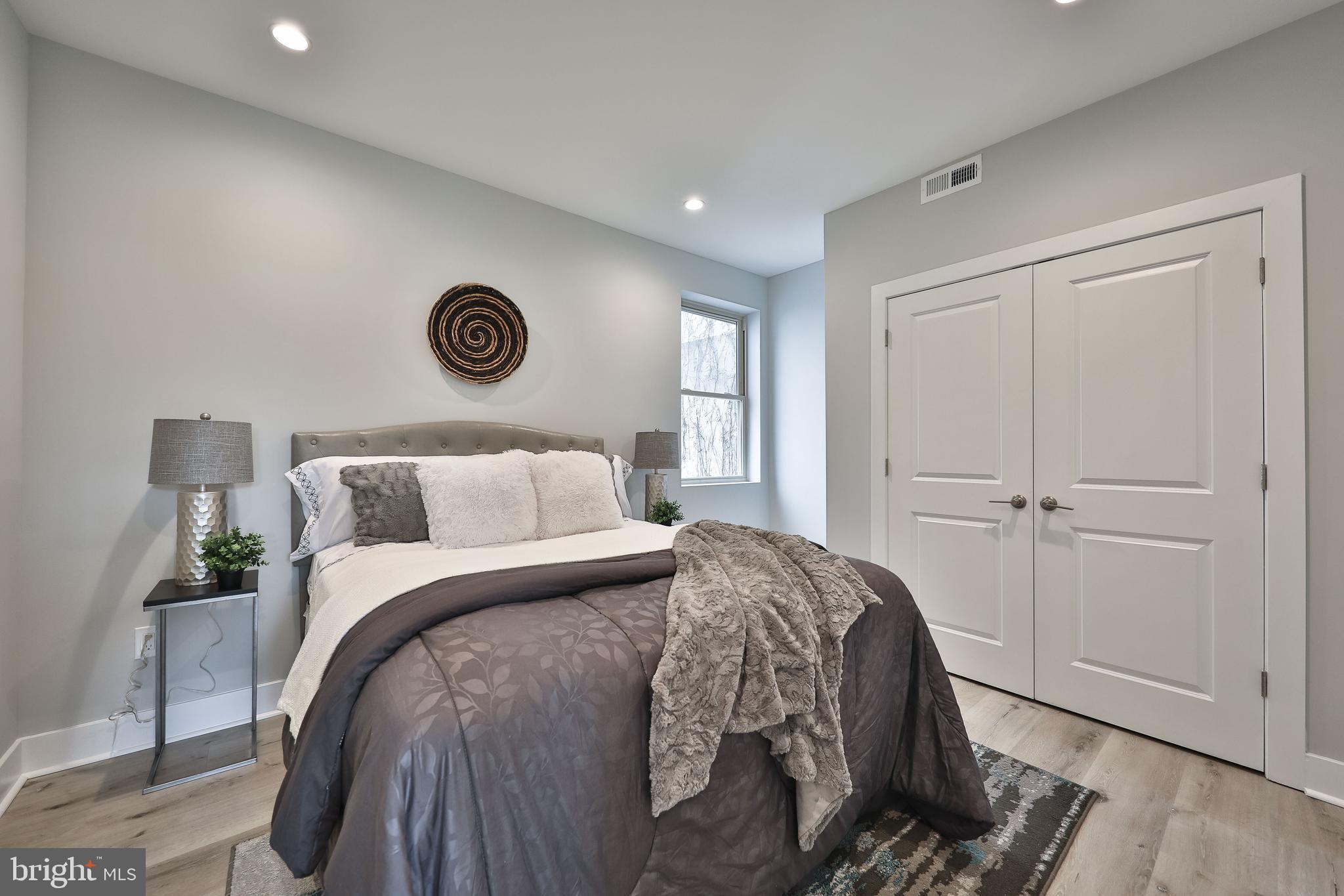 1540-42 Ridge Avenue, Unit 2S Philadelphia, PA 19130 - Photo 17 of 20 a bedroom with a bed and a window