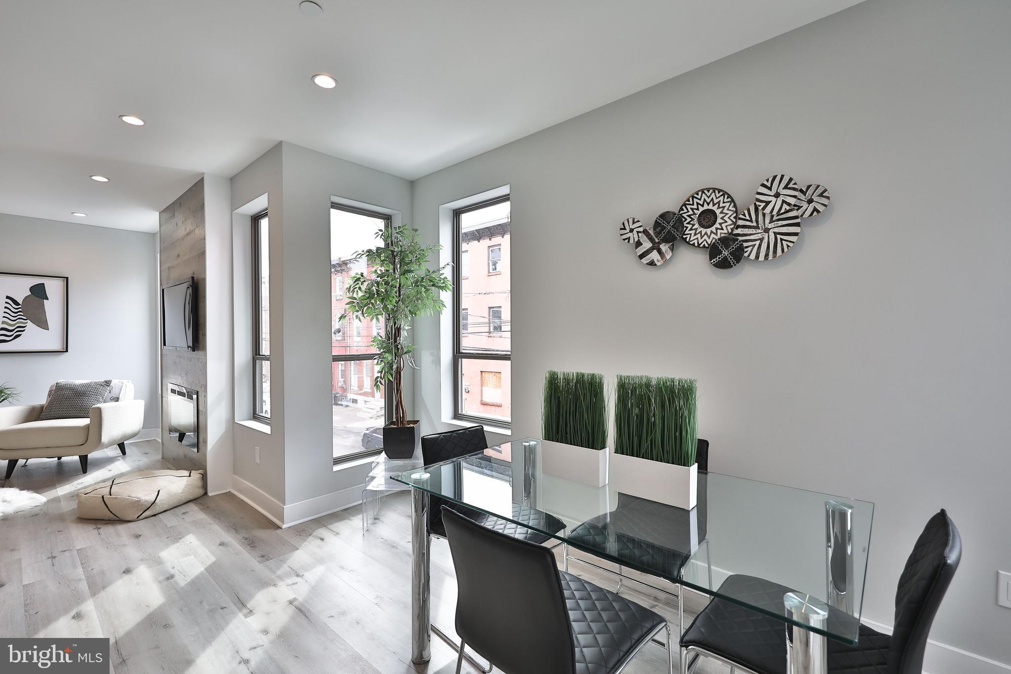 1540-42 Ridge Avenue, Unit 2S Philadelphia, PA 19130 - Photo 9 of 20 a living room with furniture and a window
