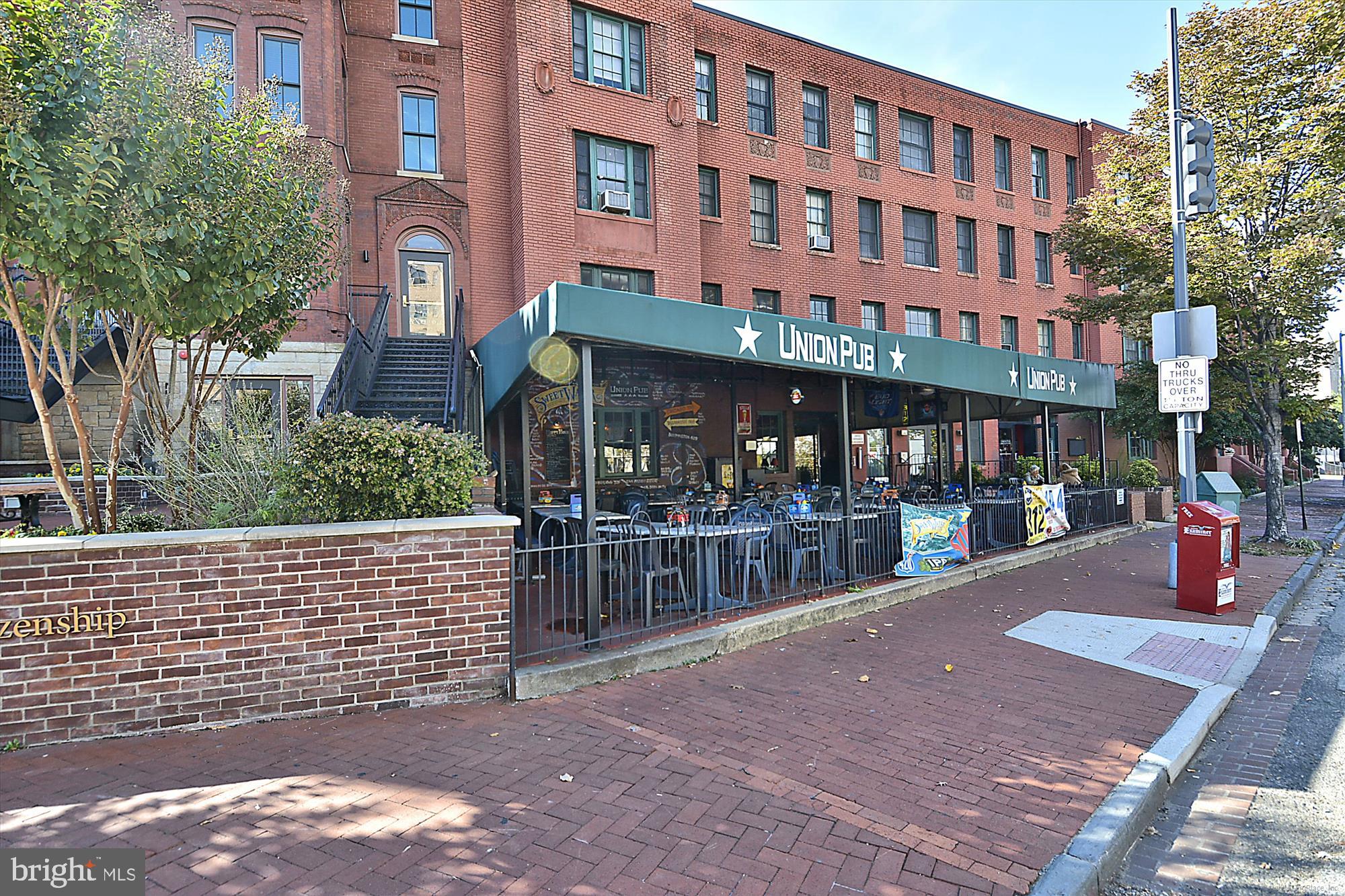 643 E Street Northeast Washington, DC 20002 - Photo 39 of 59 a view of brick building with a bench in front