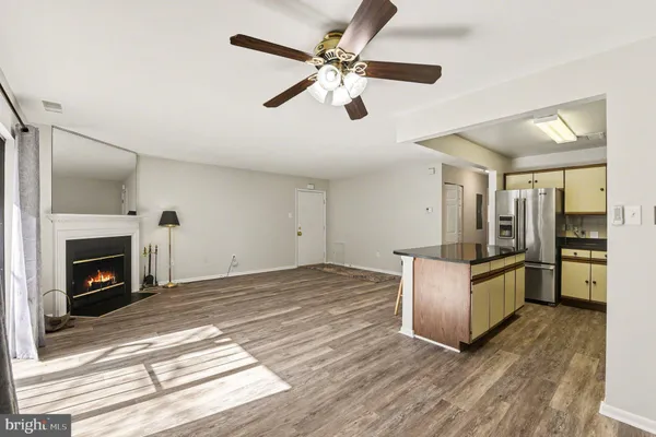 a kitchen with stainless steel appliances granite countertop a stove and a refrigerator