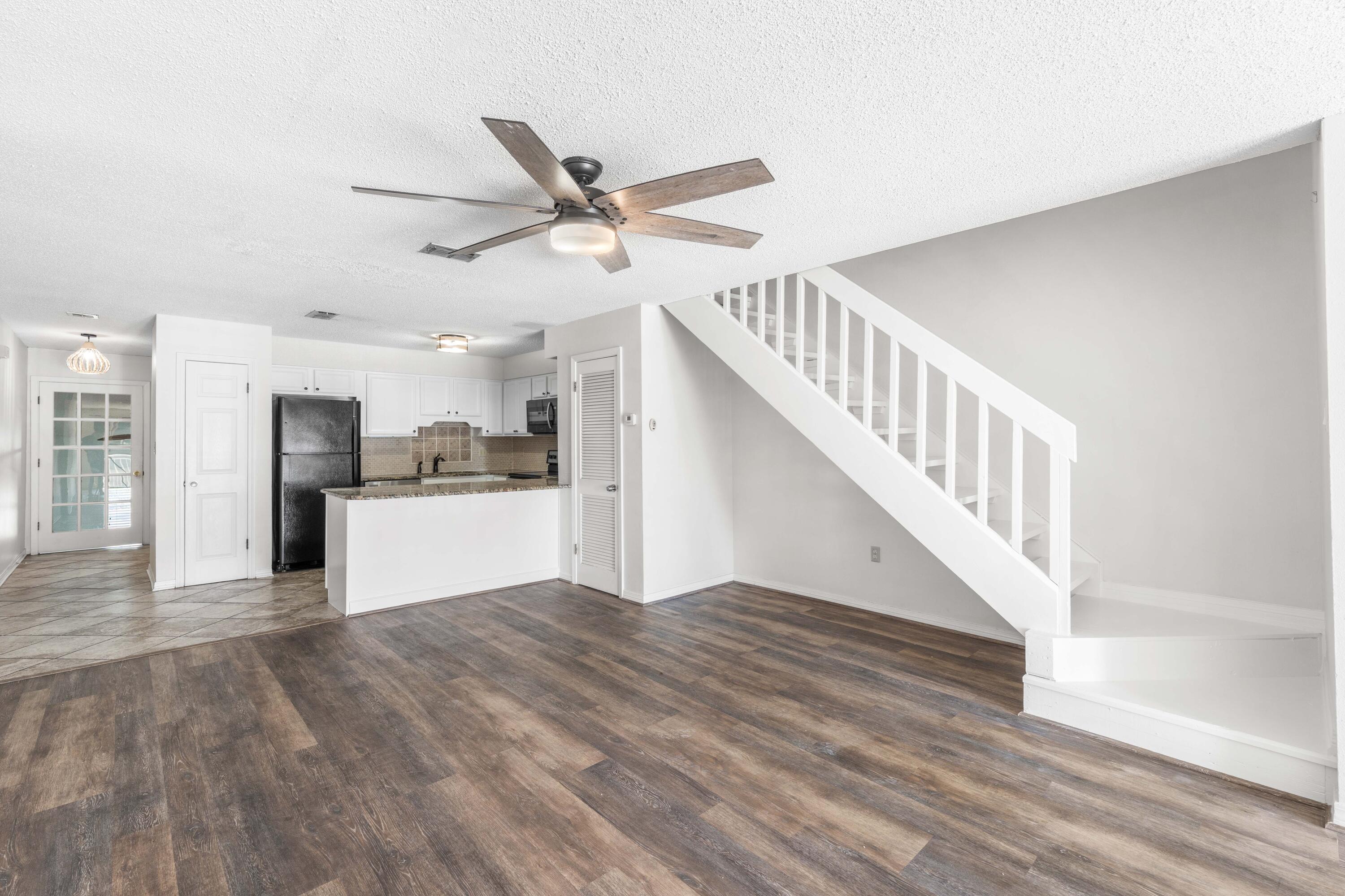 3654 East County Highway 30A, Unit 8B Santa Rosa Beach, FL 32459 - Photo 12 of 42 a view of kitchen with cabinets and wooden floor