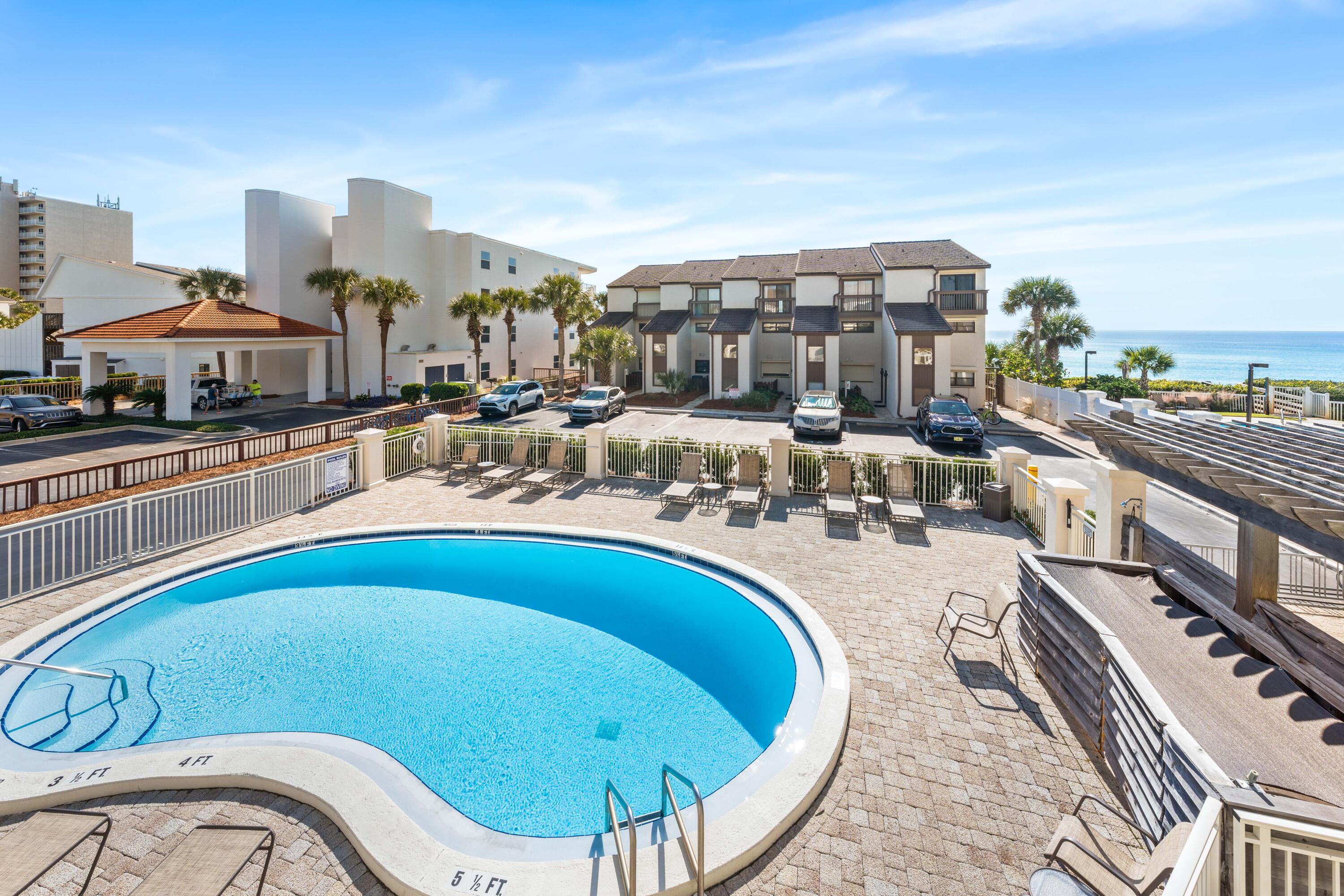 3654 East County Highway 30A, Unit 8B Santa Rosa Beach, FL 32459 - Photo 15 of 42 a view of a swimming pool with outdoor seating