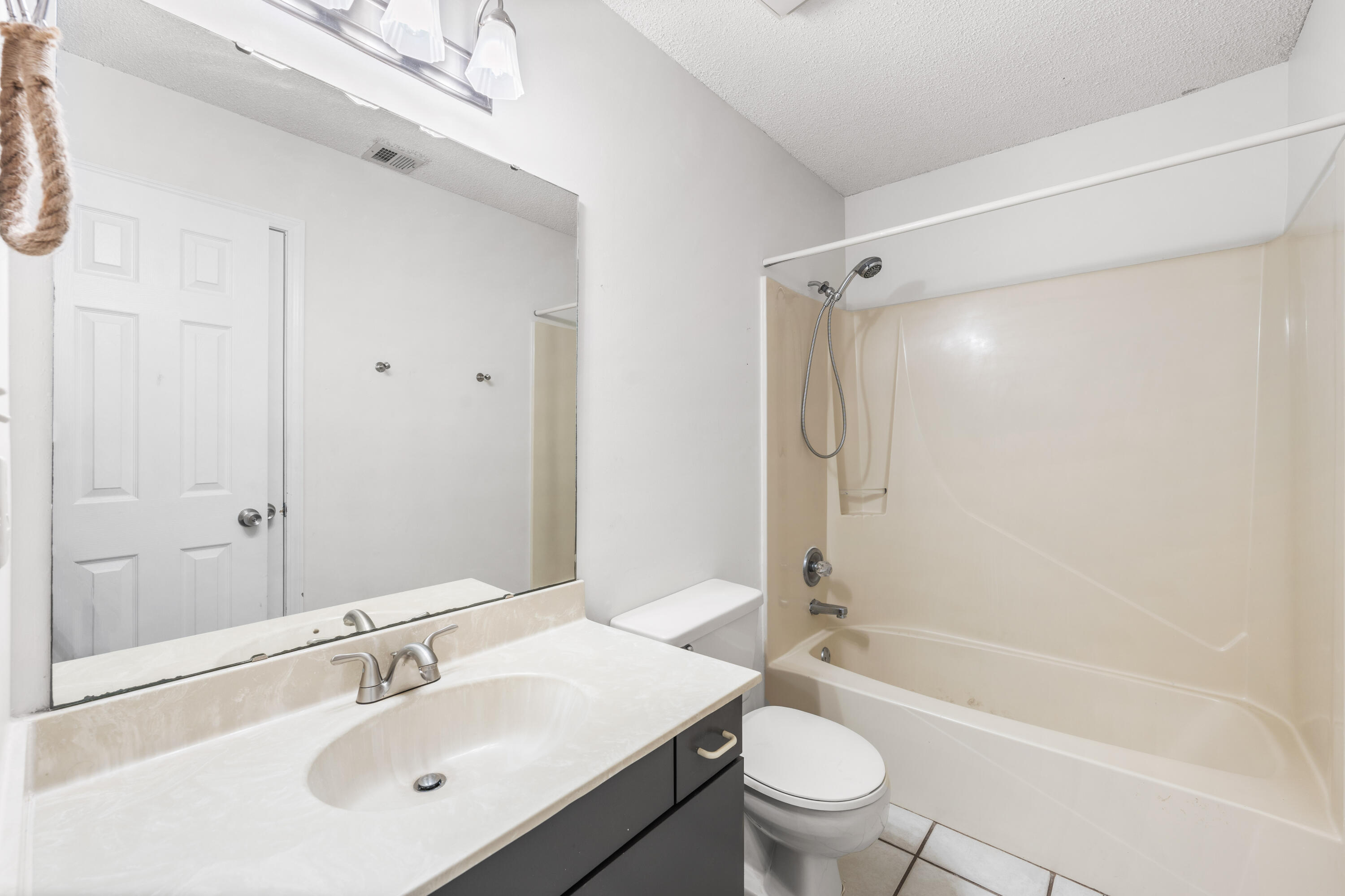 3654 East County Highway 30A, Unit 8B Santa Rosa Beach, FL 32459 - Photo 19 of 42 a bathroom with a sink a toilet and shower