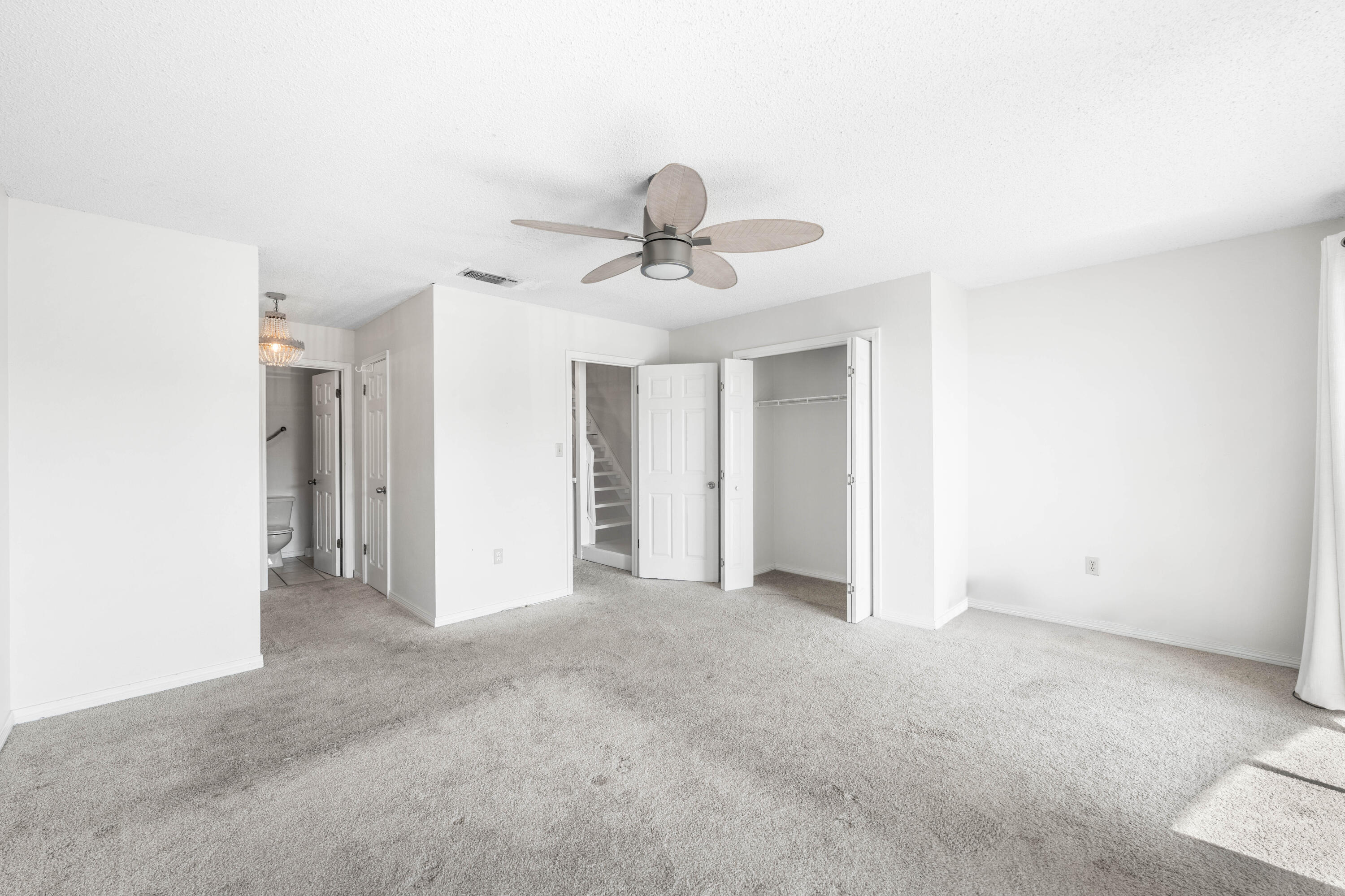 3654 East County Highway 30A, Unit 8B Santa Rosa Beach, FL 32459 - Photo 23 of 42 a view of a livingroom with a chandelier fan
